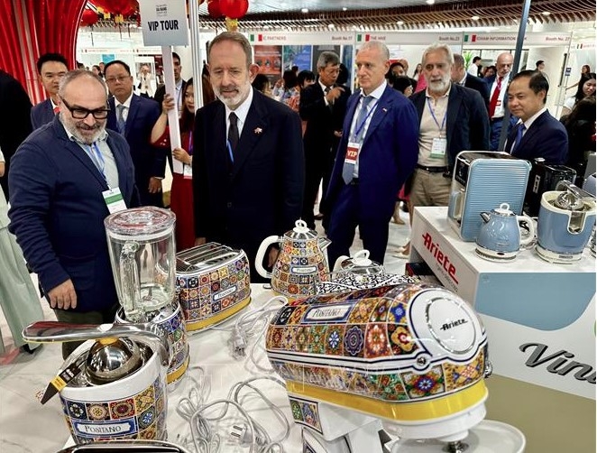 Delegates visit booths displaying Italian products at the event