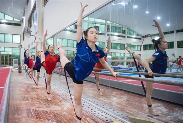 The Vietnamese gymnastics team train hard for the upcoming SEA Games 33. (Photo: hanoimoi.vn)