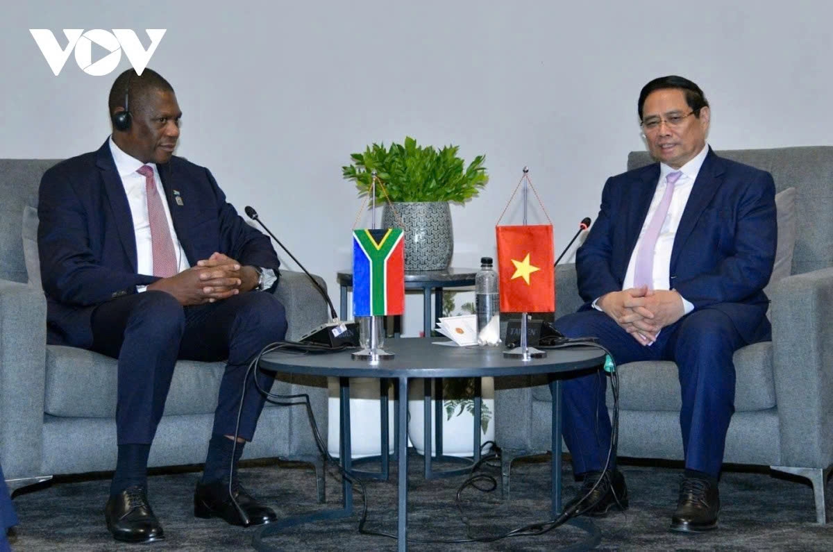 Vietnamese Prime Minister Pham Minh Chinh (R) meets with South African Deputy President Paul Mashatile in Johannesburg on November 21