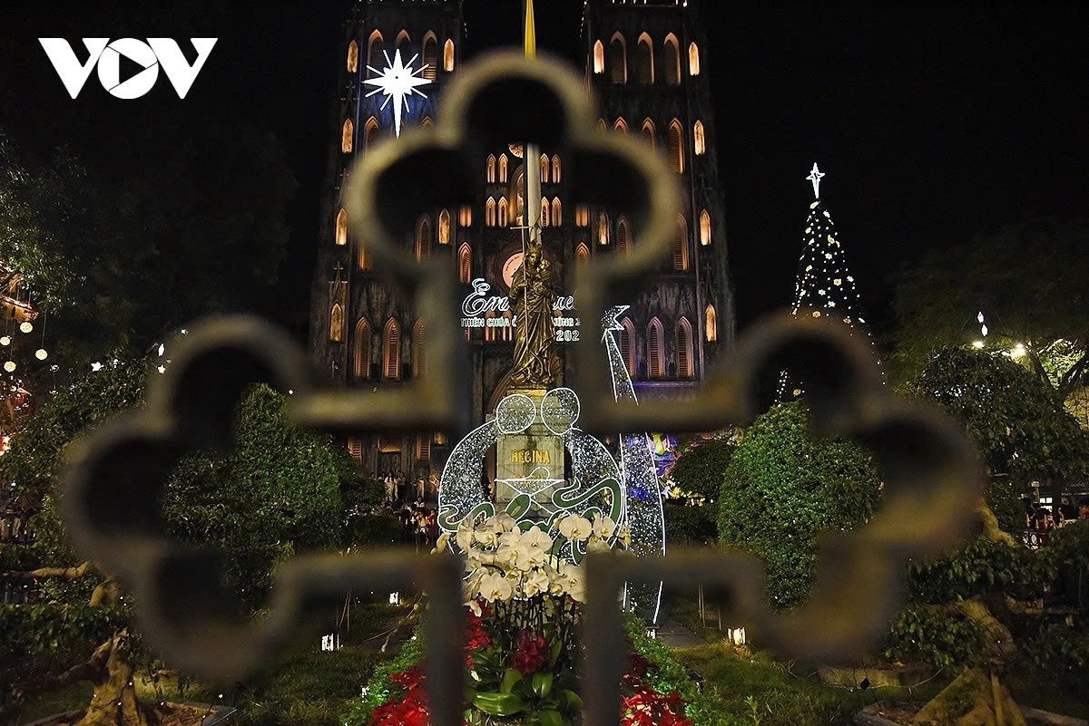 The statue of the Virgin Mary cradling the Infant Jesus stands in front of Hanoi Cathedral.