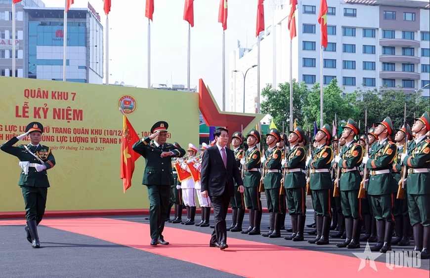 President Luong Cuong reviews the guard of honour during the 80th anniversary of the Military Region 7's armed forces in Ho Chi Minh City on December 9. (Photo: PANO)