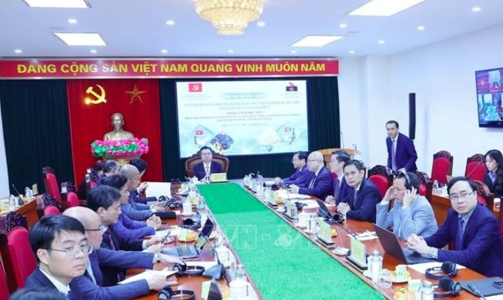 An overview of the seminar on the Party’s leadership in ensuring macroeconomic stability, renewing the growth model, restructuring the economy and promoting international integration (Photo: VNA)