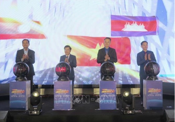 Delegates press the button to launch the festival