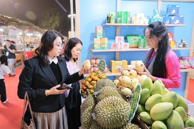 Visitors shop products at the Vietnam OCOP Festival 2025, which is one of key national trade promotion programmes. (Photo: VNA)