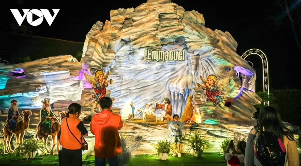 A festive display inside the Bishop’s Residence compound on Phan Chau Trinh Street in Buon Ma Thuot, featuring a Christmas tree, sparkling lights, and images of Jesus, the Virgin Mary and Saint Joseph.