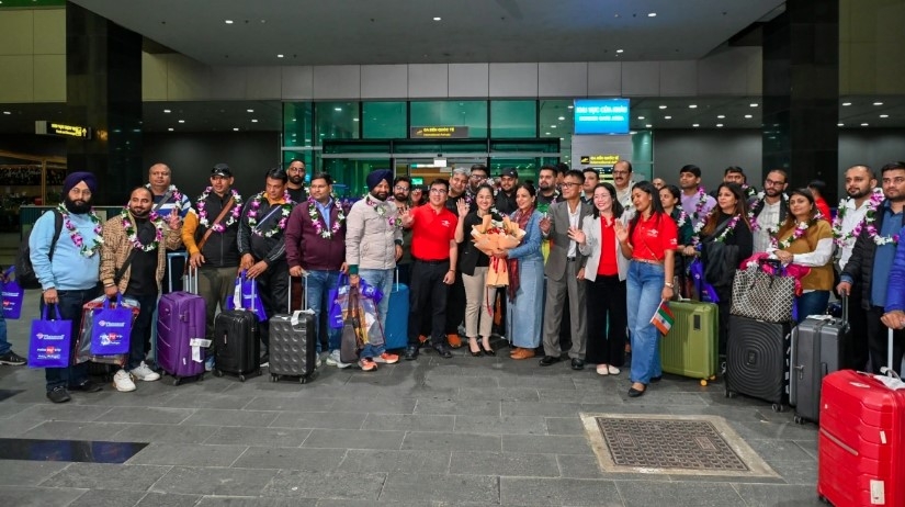 Indian tourists pose for a group photo at Phu Quoc International Airport
