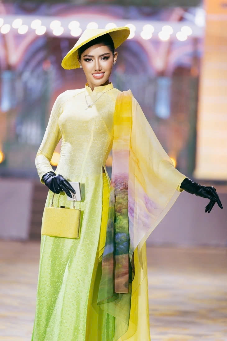 The fashion show is vibrant with accessories such as silk scarves and conical hats.