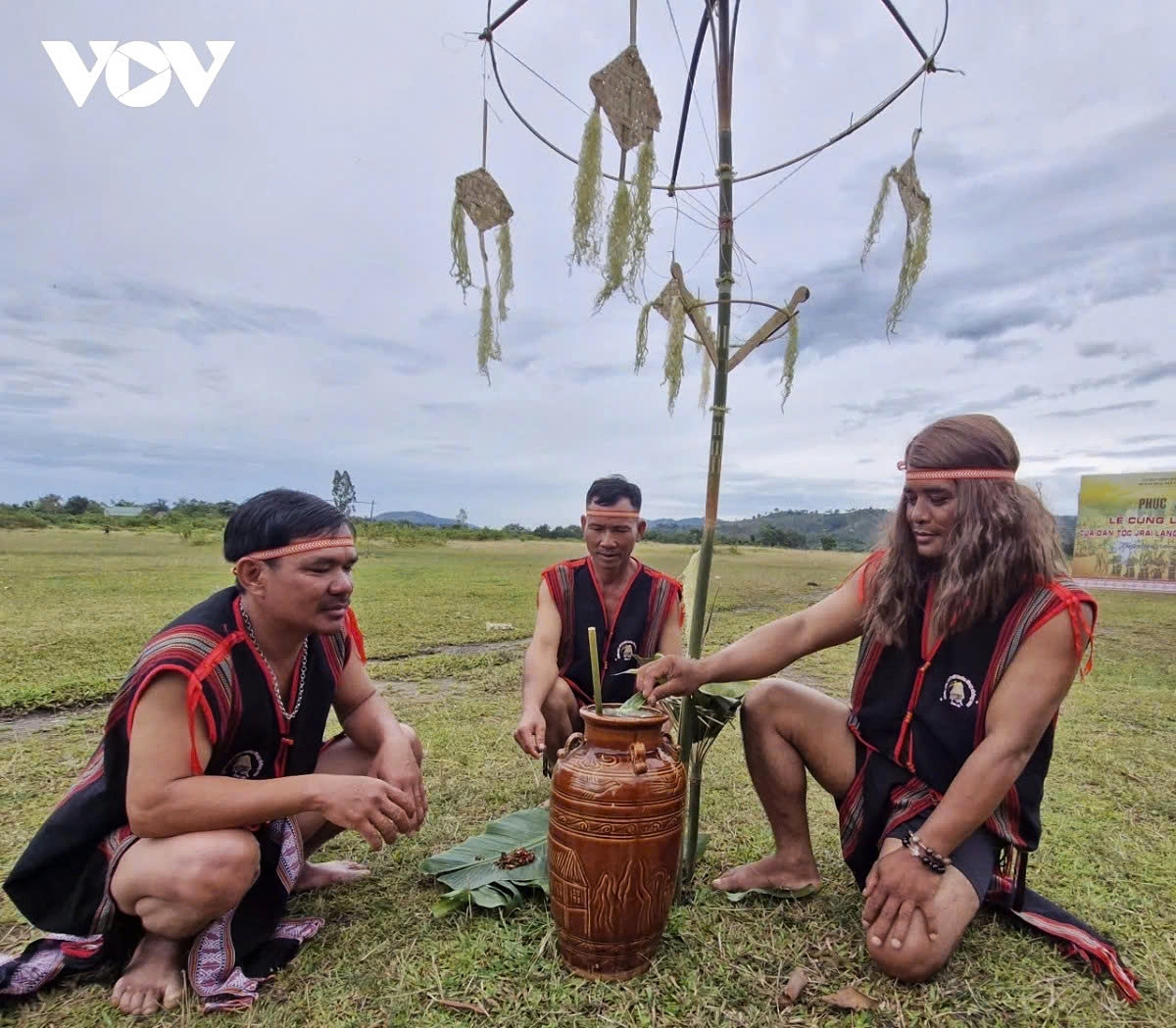 Village elder Ro Cham Hya (first, right) and two respected members of the village preside over the ceremony