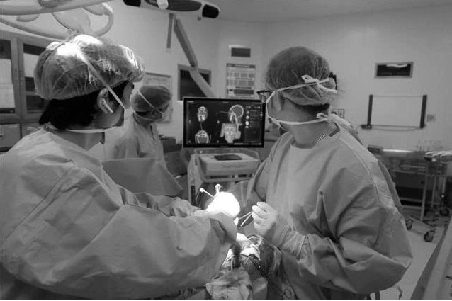 3D facial reconstruction technology and neuronavigation enable successful surgery for a brain tumour patient with maxillofacial trauma