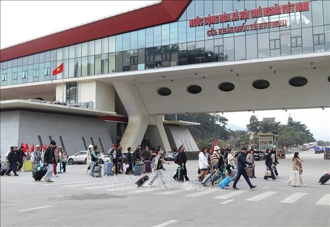 Passengers pass through the Huu Nghi International Border Gate in Lang Son province
