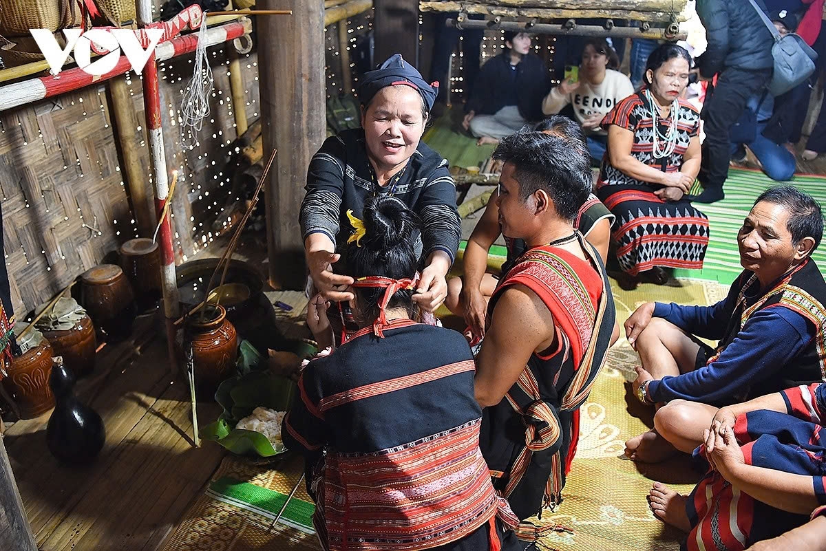 The bride’s family invites the groom’s family to share wine, while the bride’s mother offers advice to the young couple before the ceremony.