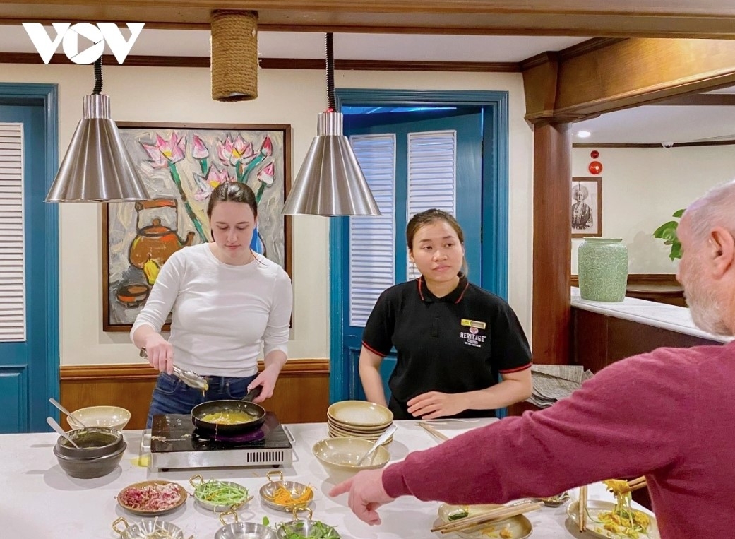 European tourists enjoy a cooking class on the Heritage Binh Chuan cruise in Lan Ha Bay, Quang Ninh province