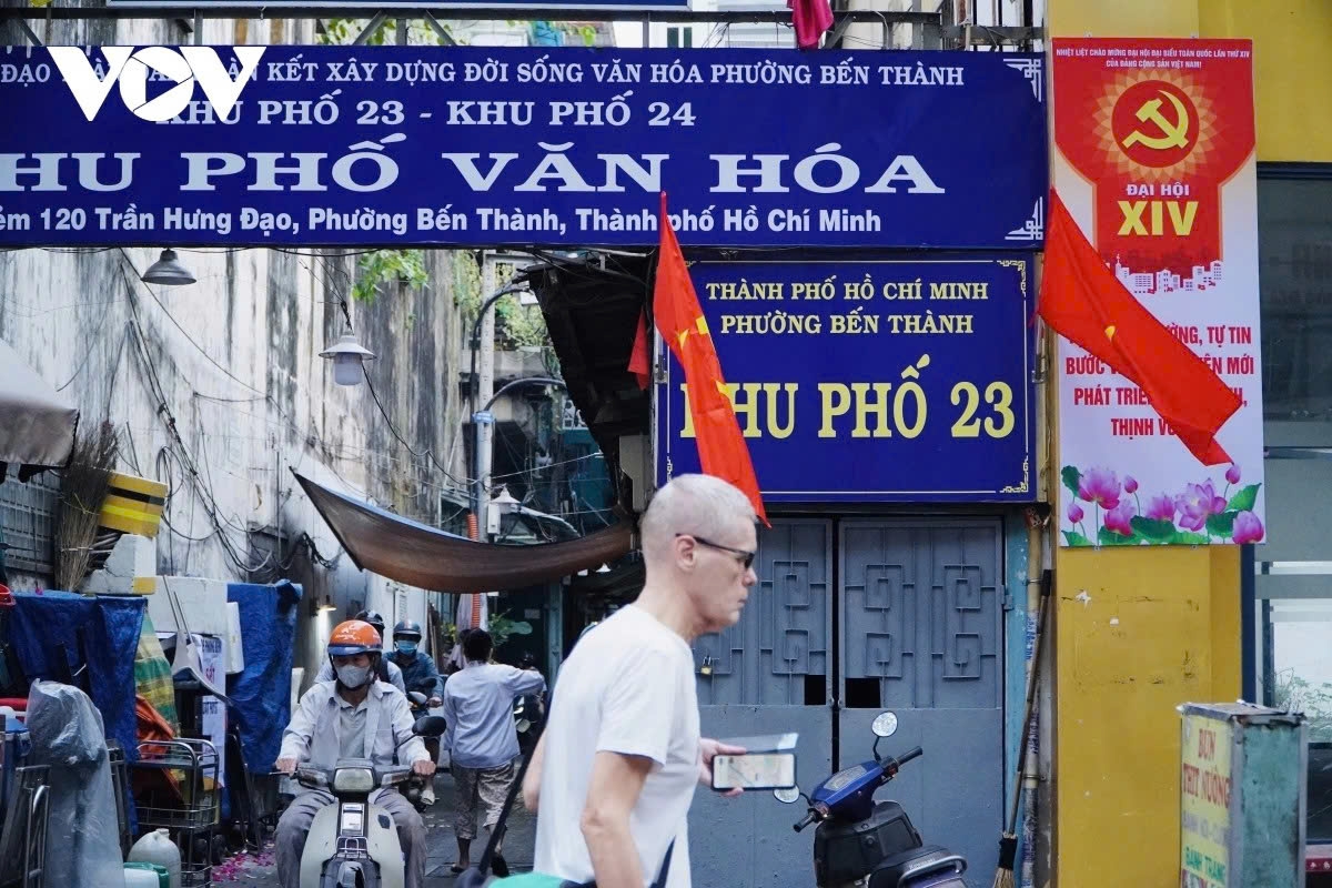 Alley No. 120 on Tran Hung Dao Street is filled with national flags, panels and slogans to celebrate the country's biggest political event.