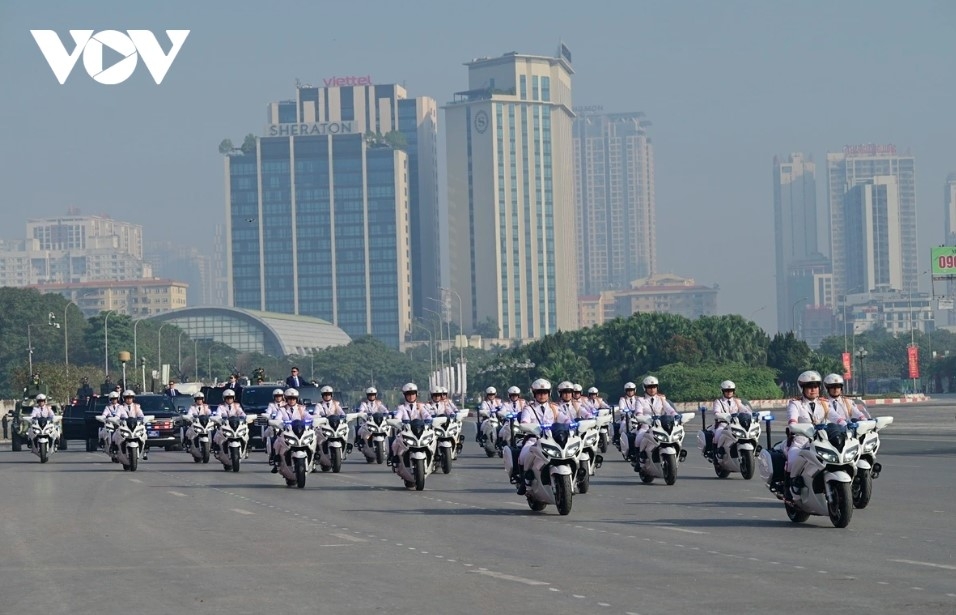 Motorcycles and cars of the Protective Security Command escort Party and State leaders and international delegations.