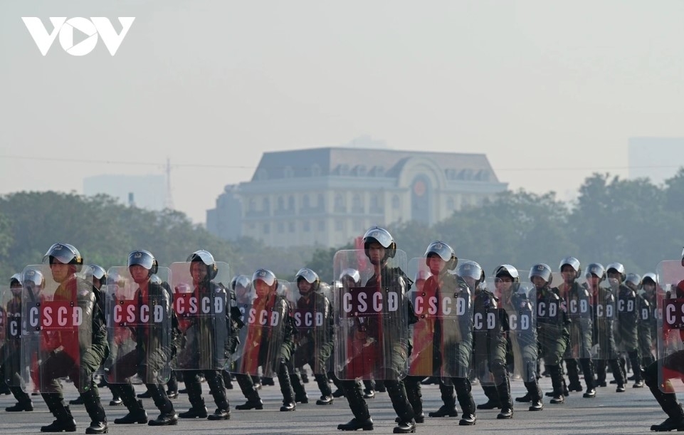 The ceremony concludes with a synchronized martial arts performance by the mobile police force.