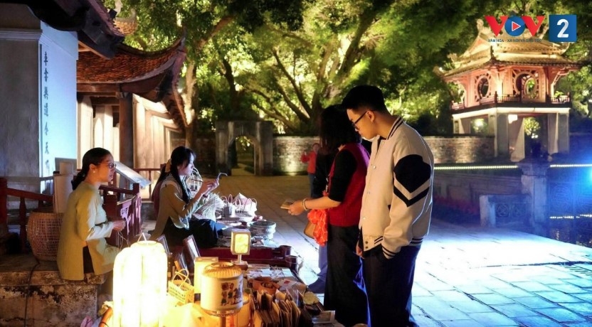 Visitors experience nighttime activities at the Temple of Literature in Hanoi 