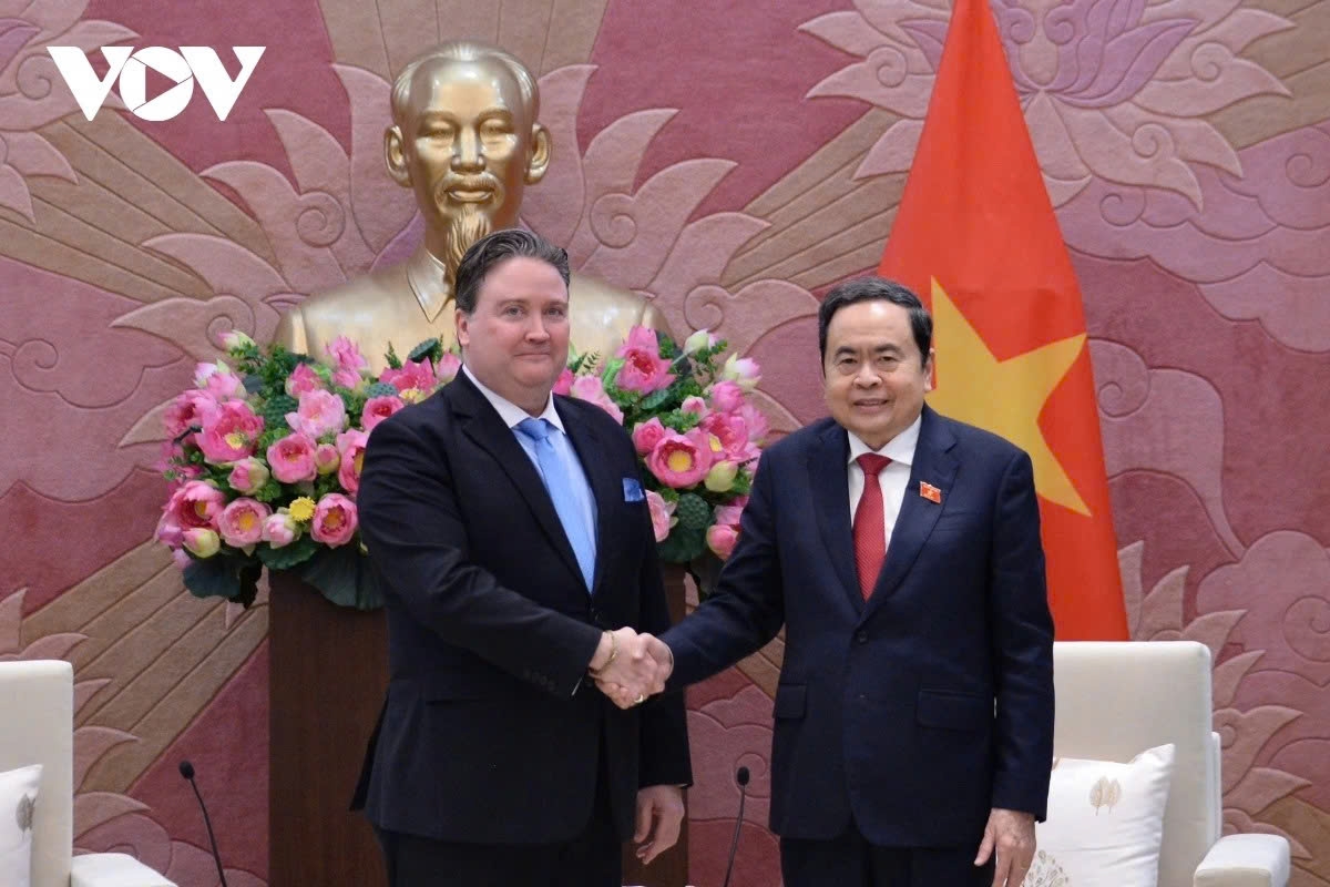 Vietnamese National Assembly Chairman Tran Thanh Man (R) receives outgoing US Ambassador Marc Knapper in Hanoi on January 13