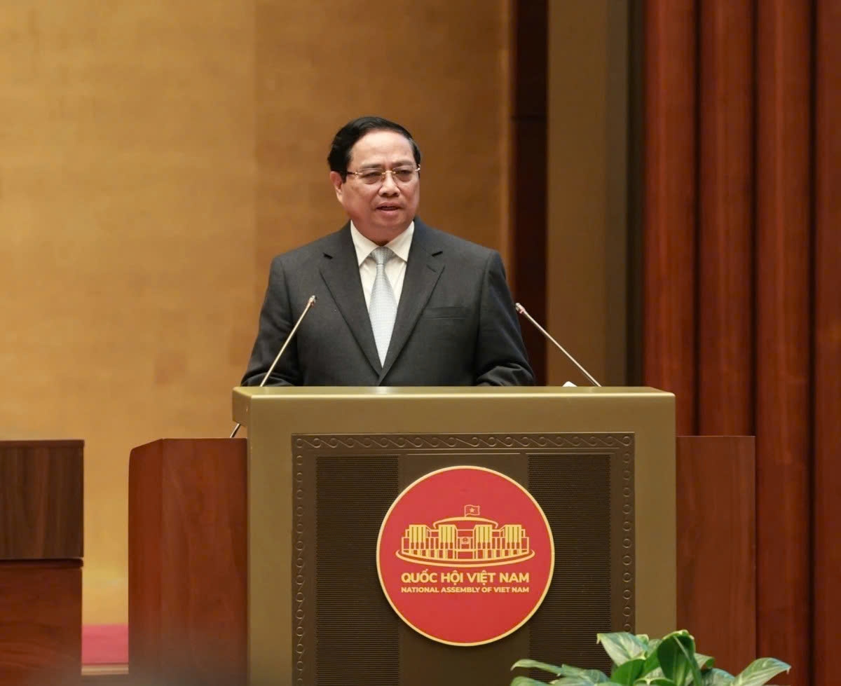 Prime Minister Pham Minh Chinh presents a thematic report on the Party's Action Programme implementing the Resolution of the 14th National Party Congress at a nationwide conference in Hanoi on February 7