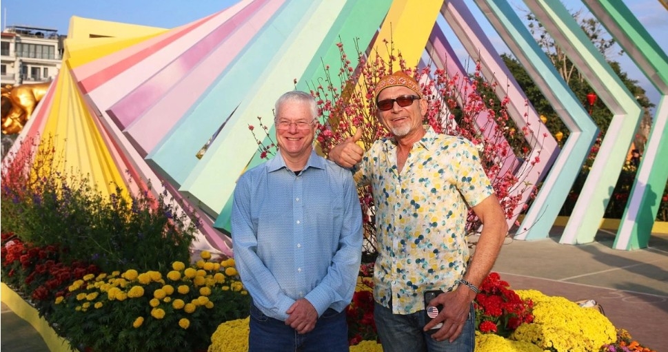 Foreign visitors also take the opportunity to experience a Vietnamese Tet amid a profusion of flowers.