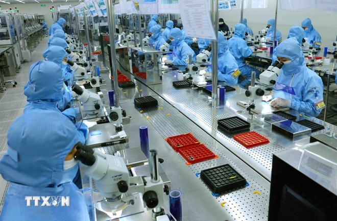 A production line for camera modules and electronic components for export at a foreign direct investment enterprise. (Photo: VNA)