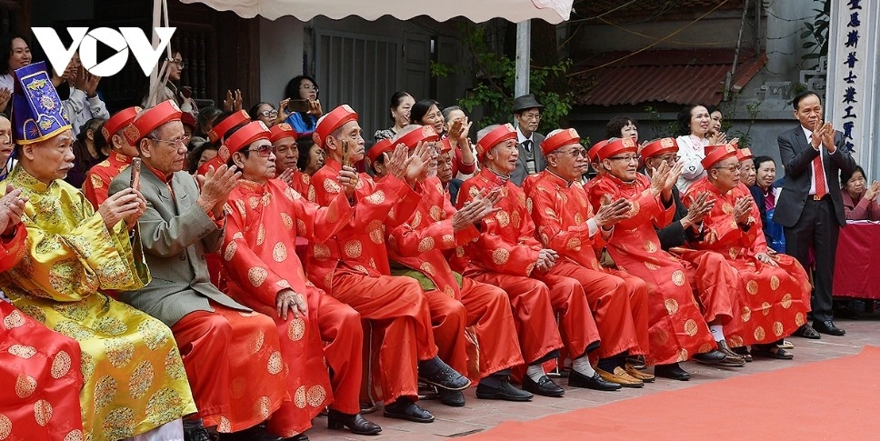 Spectators cheer enthusiastically for the wrestlers competing at the festival.