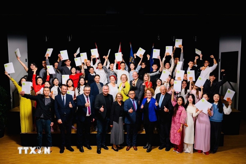 Thirty out of 150 Vietnamese students currently studying at the IMC University of Applied Sciences Krems pose for a group photo with the university's representatives