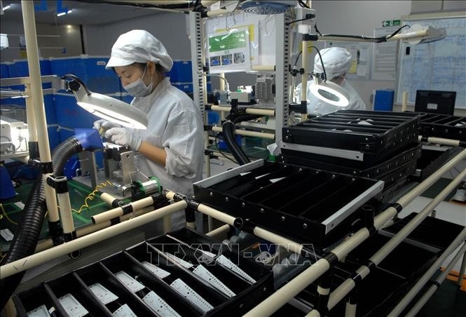 A production line for electronic devices and automotive and motorcycle lighting equipment at Vietnam Stanley Electric Co., Ltd., a Japanese-invested company in Hanoi. (Photo: VNA)