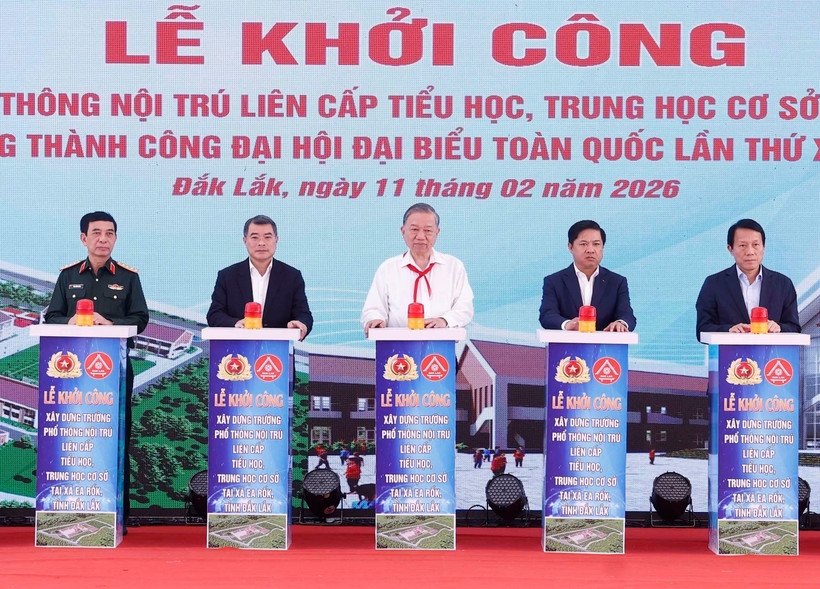 Party General Secretary To Lam (C) and other delegates press the button to break ground for the Ea Rok Primary and Secondary Boarding School project