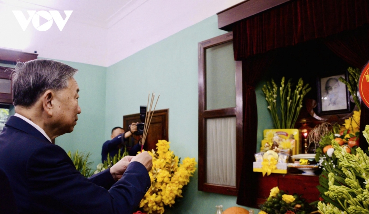 He offers incense in remembrance of President Ho Chi Minh at House 67, part of the Ho Chi Minh Relic Site at the Presidential Palace.