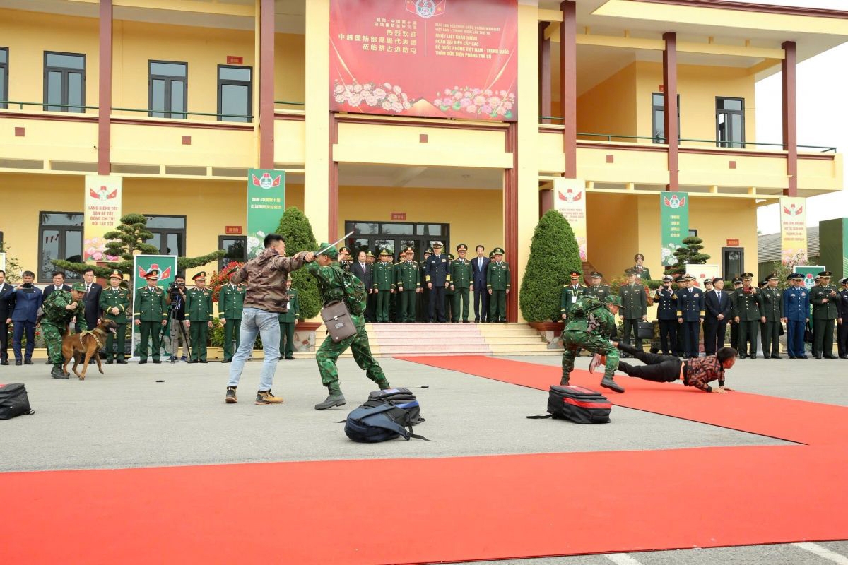 Sniffer dogs coordinate with Vietnam border guard officers to apprehend narcotics suspects at Tra Co Border Guard Post.