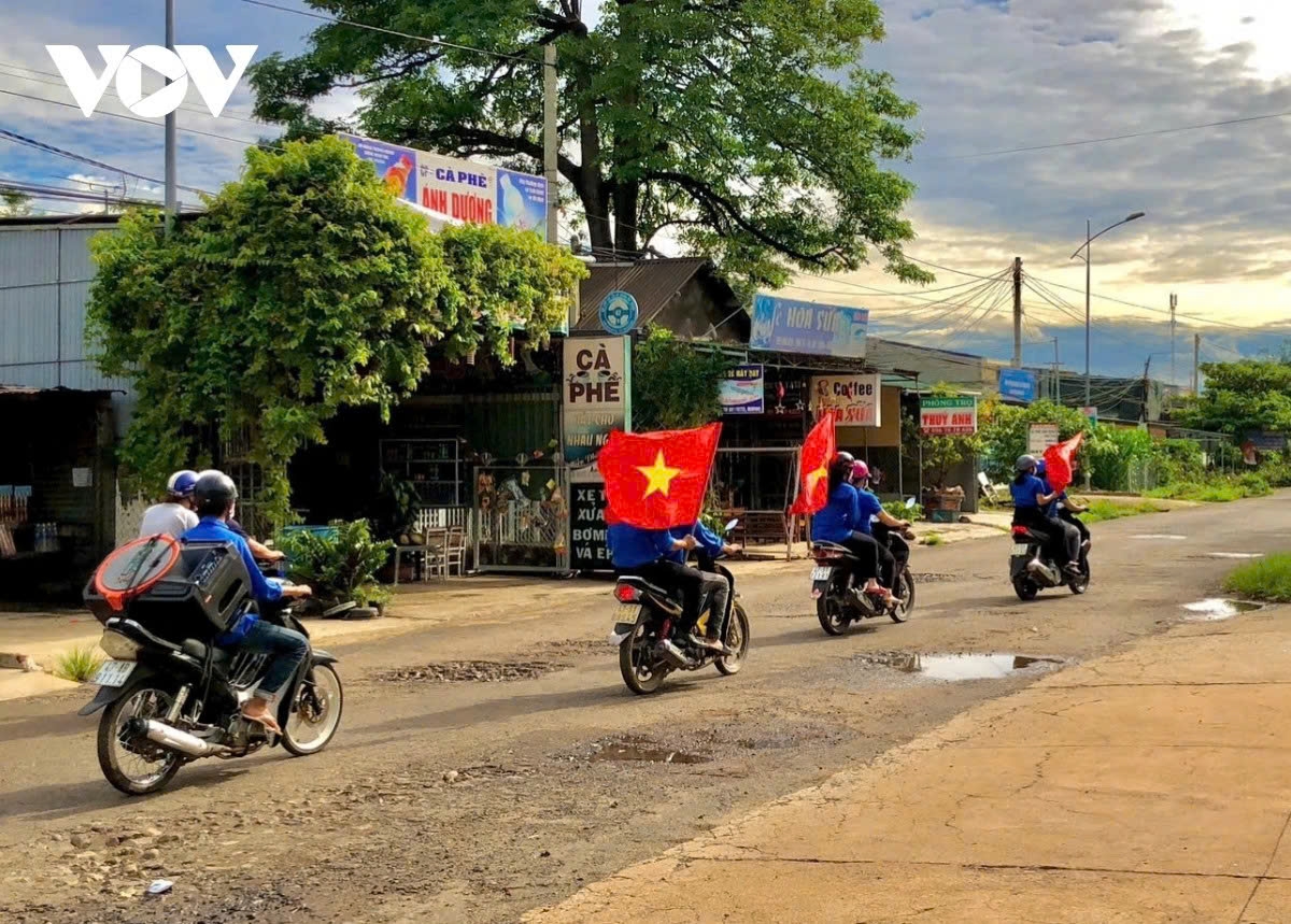 In remote areas, youth volunteers use motorbikes equipped with mobile loudspeakers to broadcast election information.