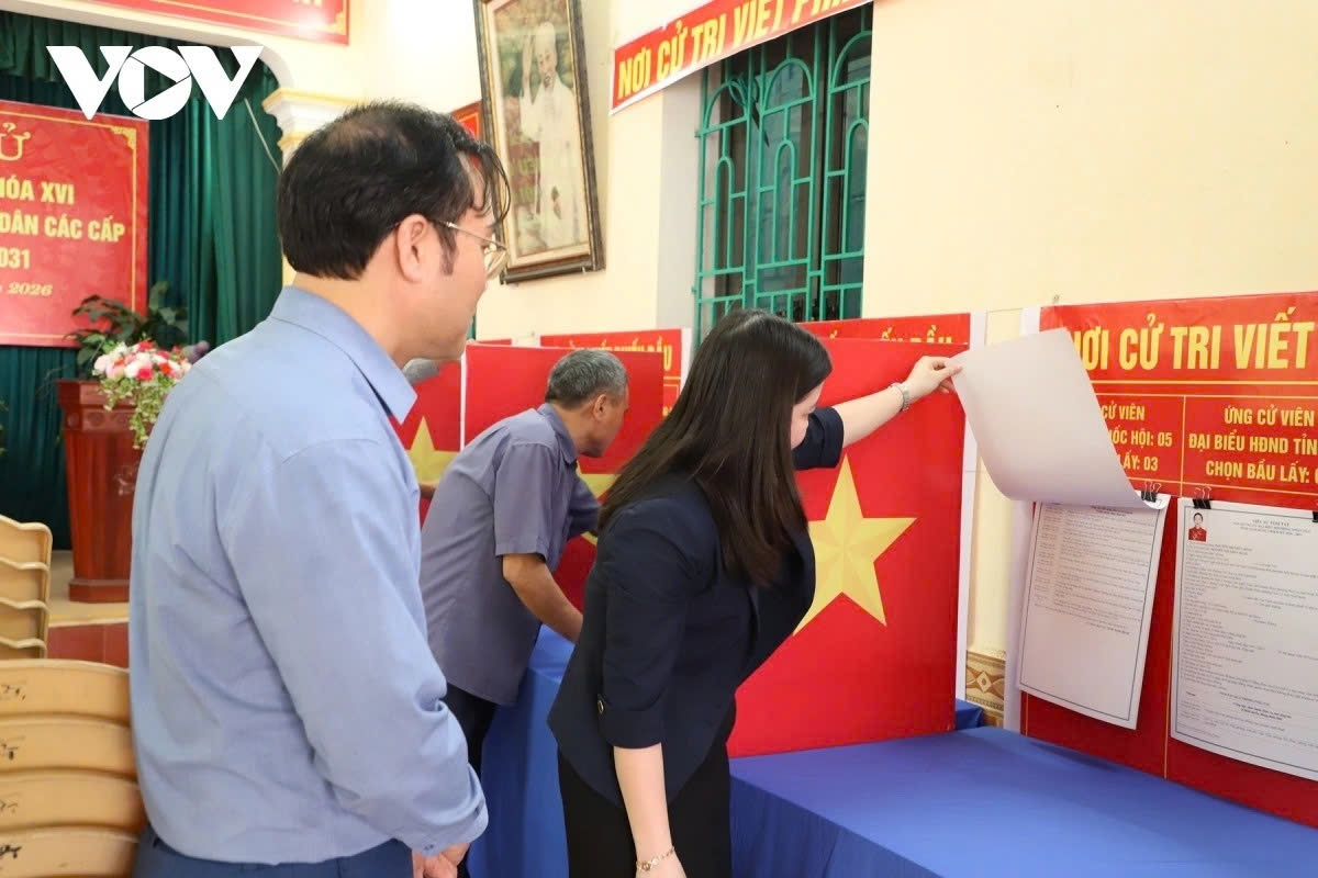 Local officials inspect preparations at a polling station to ensure proper conditions for voters.