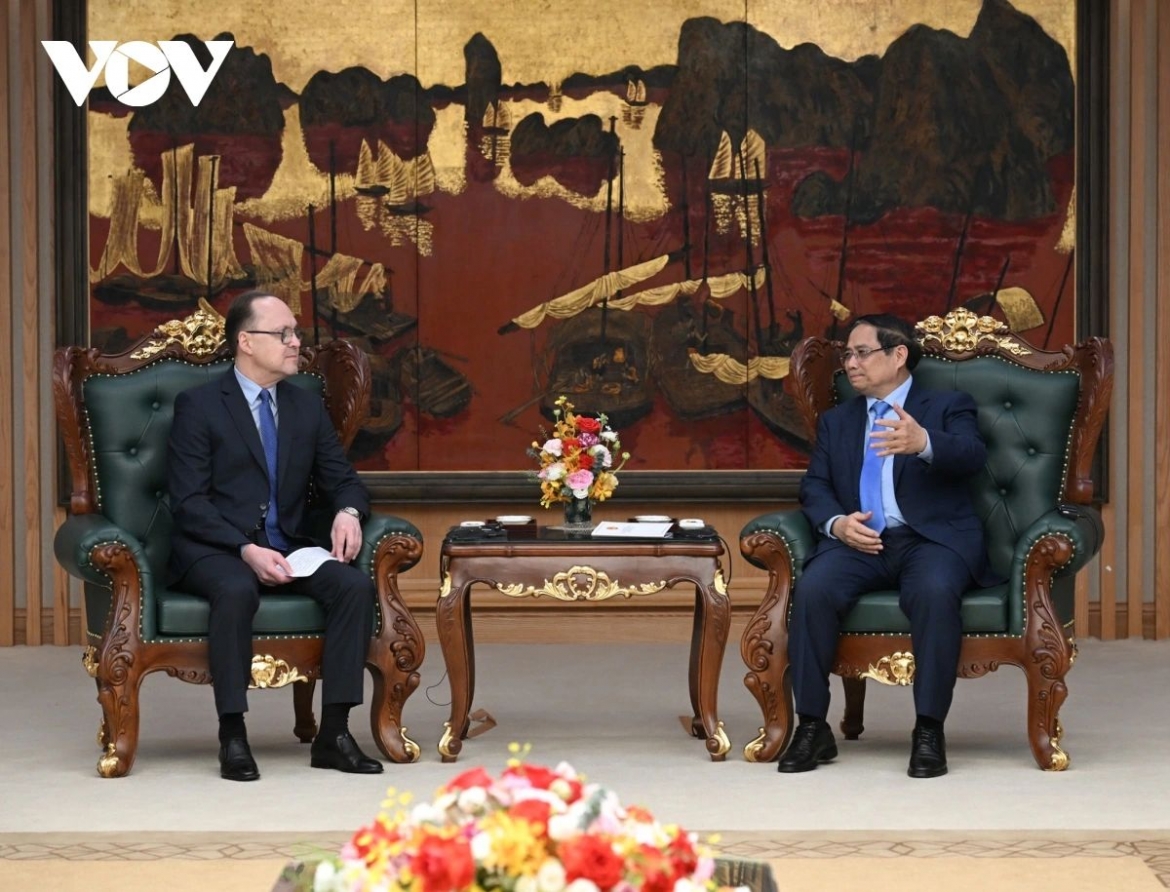 Vietnamese Prime Minister Pham Minh Chinh (R) and Russian Ambassador to Vietnam Gennady Bezdetko during their meeting in Hanoi on April 1