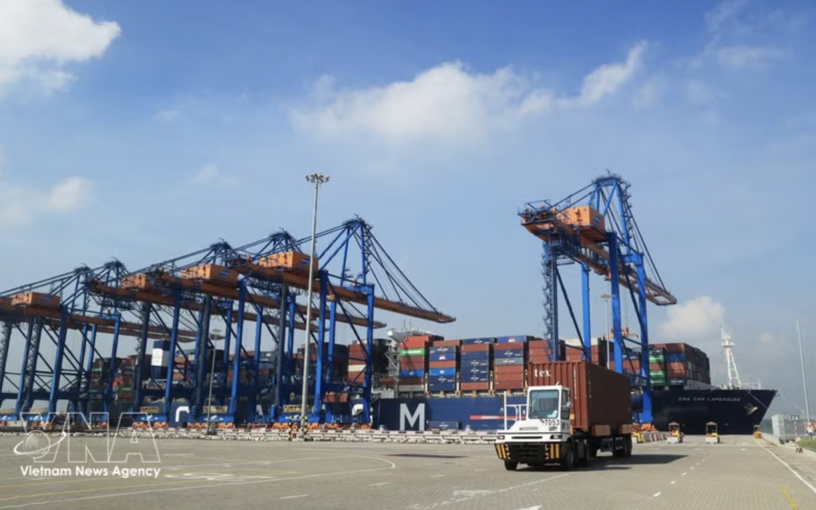 Container trucks operate at Gemalink International Port, part of the Cai Mep port complex in Tan Phuoc ward. (Photo: VNA)