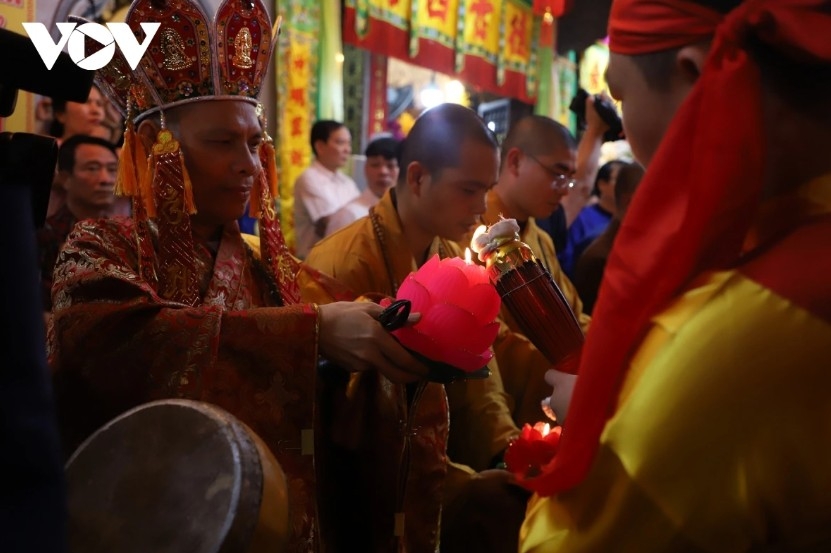The main torch’s flame is passed to thousands of torches held by locals and visitors, creating streams of light along the streets.