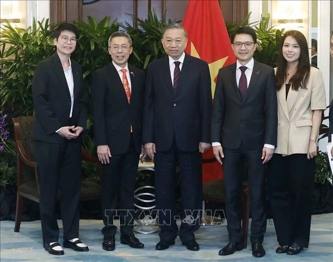Vietnam's Party General Secretary and State President To Lam (third from left) and the leadership of CapitaLand during their meeting in Singapore on May 30