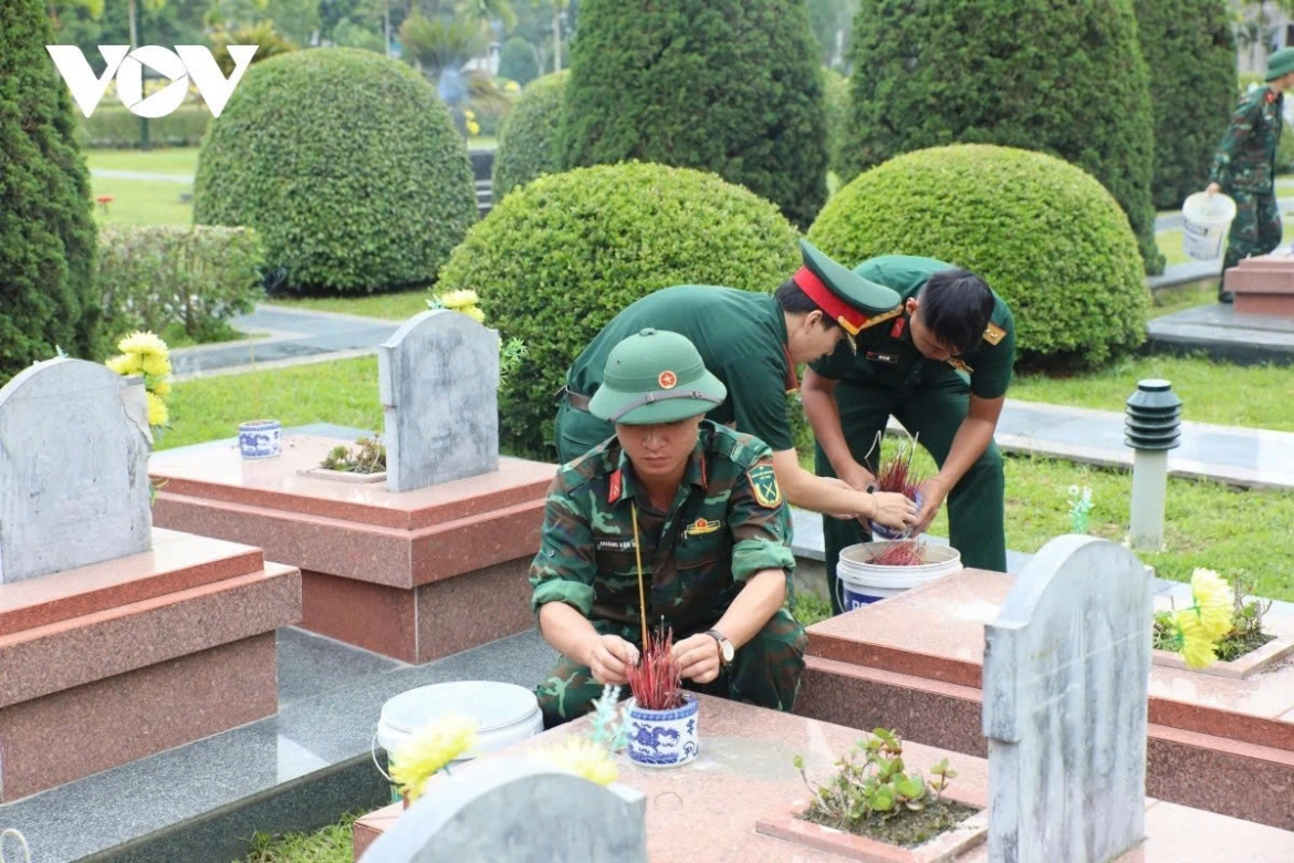 At military cemeteries, young soldiers carefully clean graves and offer incense in tribute to those who sacrificed their lives for the country.