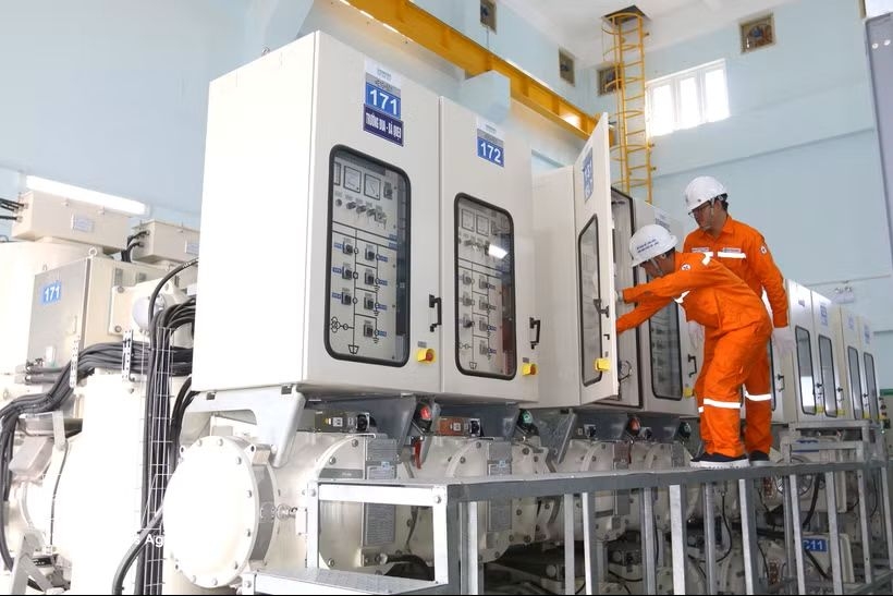 Electric workers in Ho Chi Minh City inspect the operation of the Cho Lon 110 kV substation