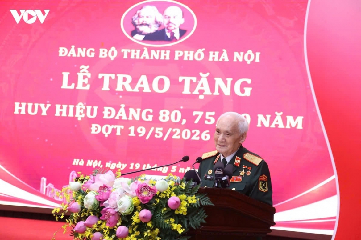 Major General Nguyen Tu representing the Party membership badge recipients speaks at the ceremony