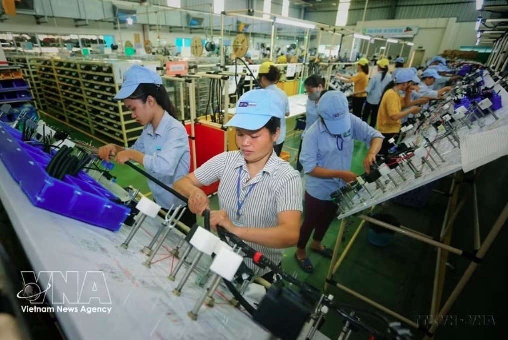 Manufacturing electrical and electronic components at Minda Vietnam Automotive Co., Ltd, an Indian-invested company in Phu Tho province. (File Photo: VNA)
