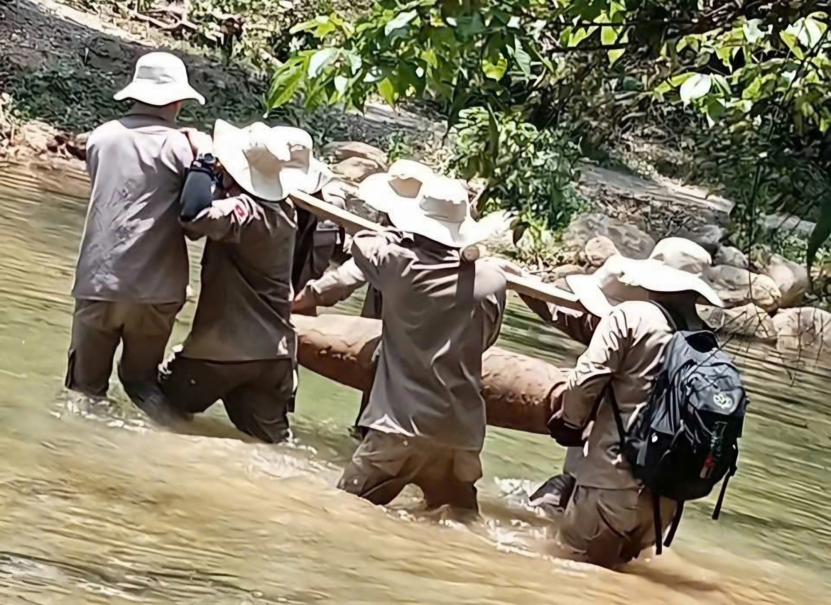 Relocating the unexploded wartime bomb to a secure site for disposal in accordance with safety procedures