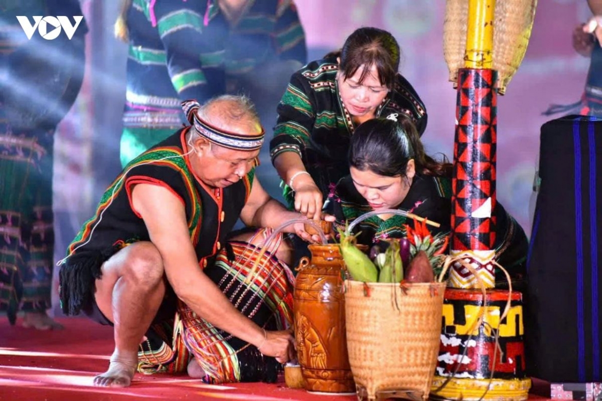 Artisan H'Brơi (C) takes part in the traditional M'nong rain-praying ritual , helping preserve her community's cultural heritage