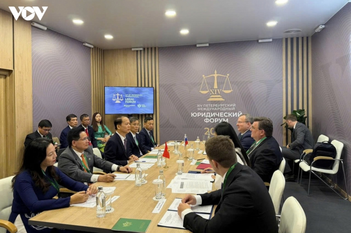 Vietnamese Minister of Justice Hoang Thanh Tung during a working session with his Russian counterpart Konstantin Chuychenko