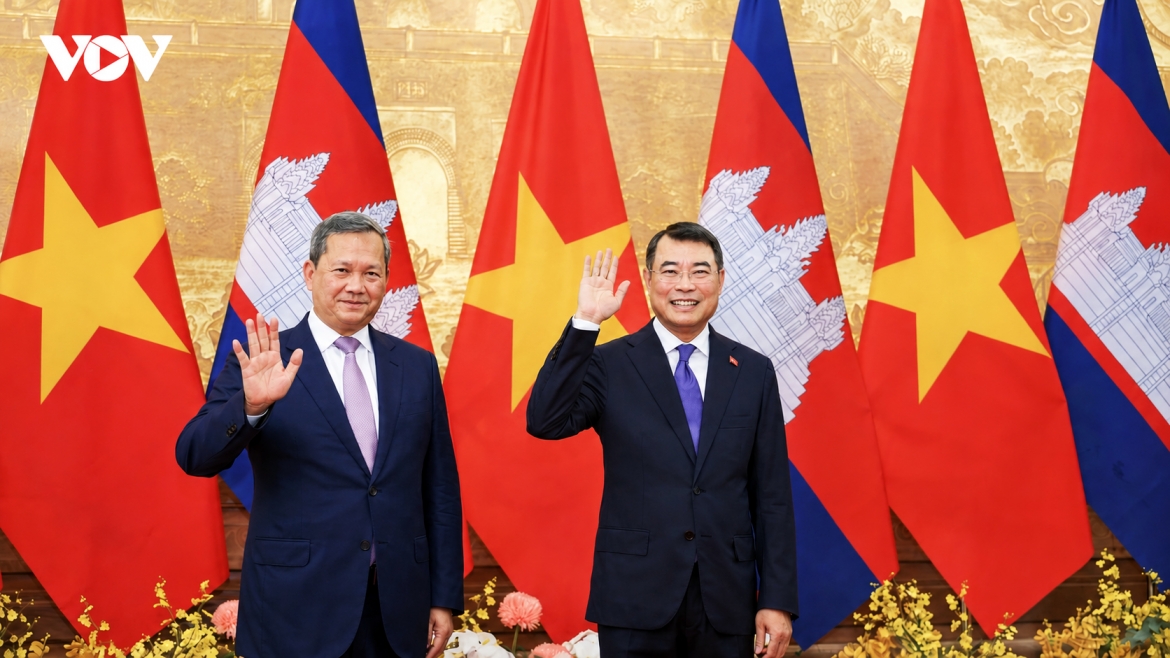 Vietnamese Prime Minister Le Minh Hung and his visiting Cambodian counterpart Hun Manet pose for a group photo ahead of their talks in Hanoi on June 8, 2026