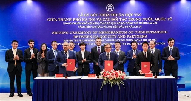 Truong Viet Dung, Vice Chairman of the Hanoi People's Committee, with representatives of G-Group and OTECH at the MoU signing ceremony. — Photo courtesy of the firm