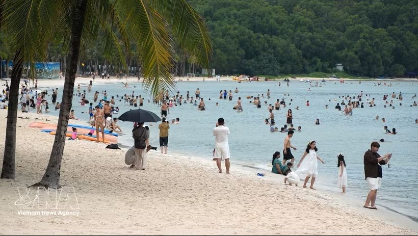 Tourists enjoy Khem beach in Phu Quoc Special Zone, An Giang province