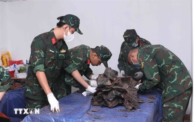 The post-excavation procedures for fallen soldiers' remains are carried out with care, precision and scientific rigour to ensure their safe preservation. VNA/VNS Photo Xuan Khu