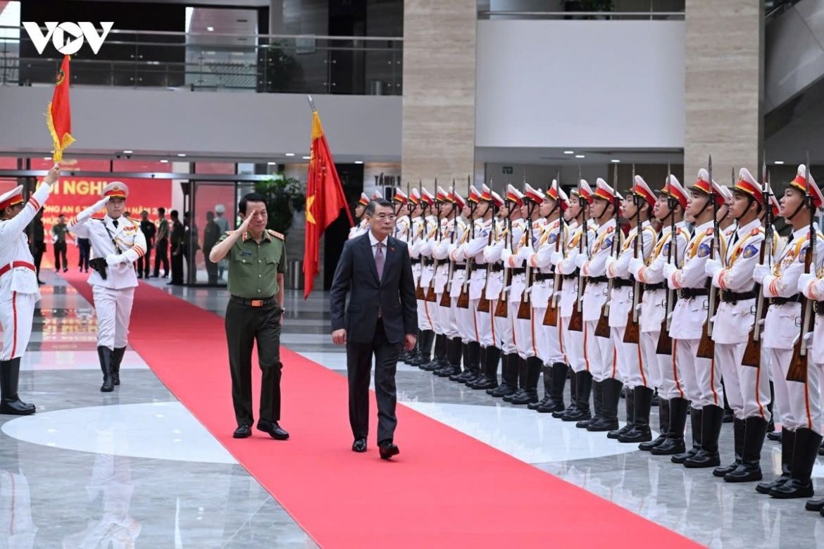 Prime Minister Le Minh Hung and Minister of Public Security Luong Tam Quang review the guard of honour of the Public Security Force in Hanoi on July 2