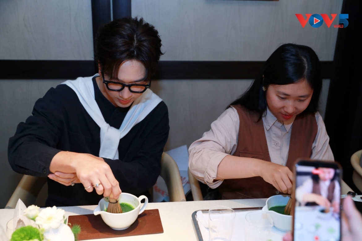 Visitors take part in a traditional Japanese tea ceremony