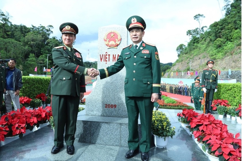 Vietnamese and Lao defence ministers at Border Marker No. 460